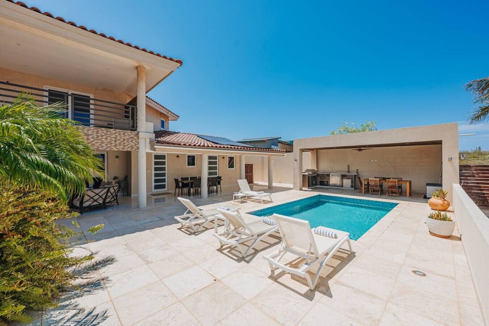 Welcome to your private oasis. Dive into relaxation by the pool, unwind on the sun loungers, and enjoy outdoor dining in this beautifully designed space.