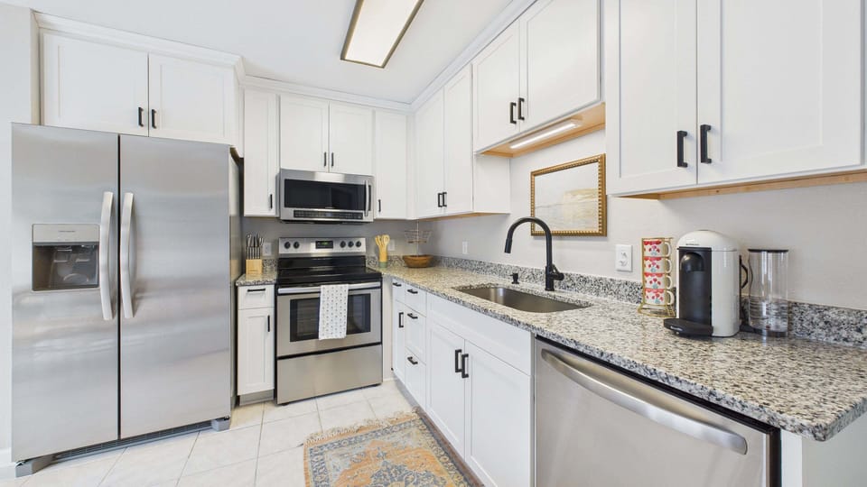 Fully applianced kitchen with stainless appliances