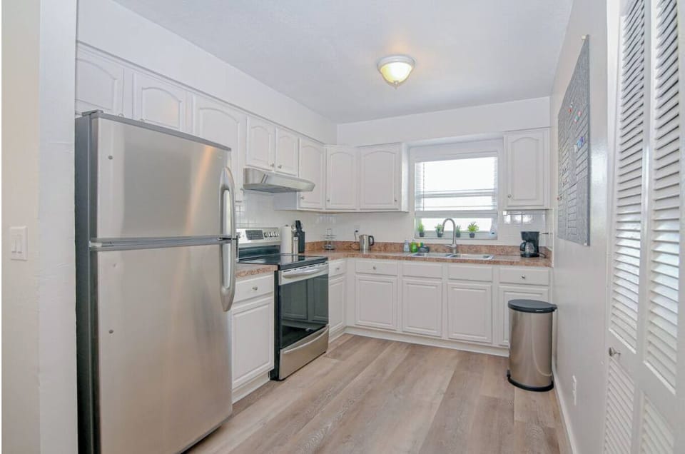 Fully equipped kitchen with modern appliances, making it easy to prep meals and stay energized while working remotely.