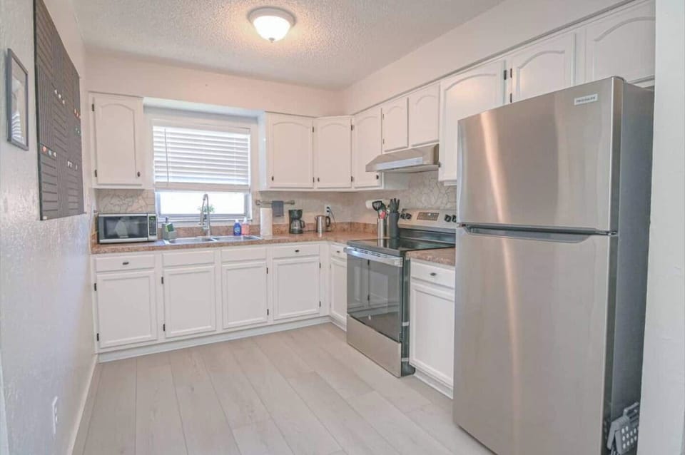 Fully equipped kitchen with modern appliances, making it easy to prep meals and stay energized while working remotely.