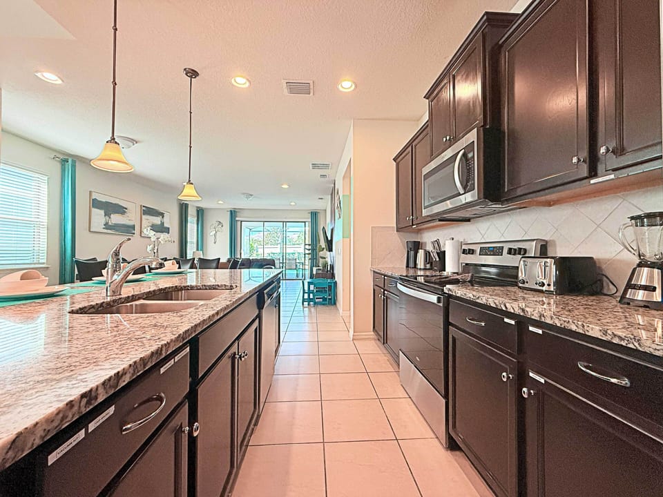 Fully-equipped kitchen—stainless appliances & ample storage for extended stays.