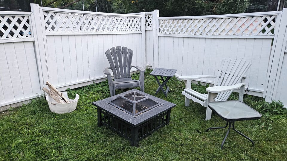 cozy backyard firepit area and outdoor play area