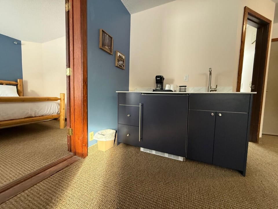 Updated kitchenette offering a mini-fridge and coffee station.