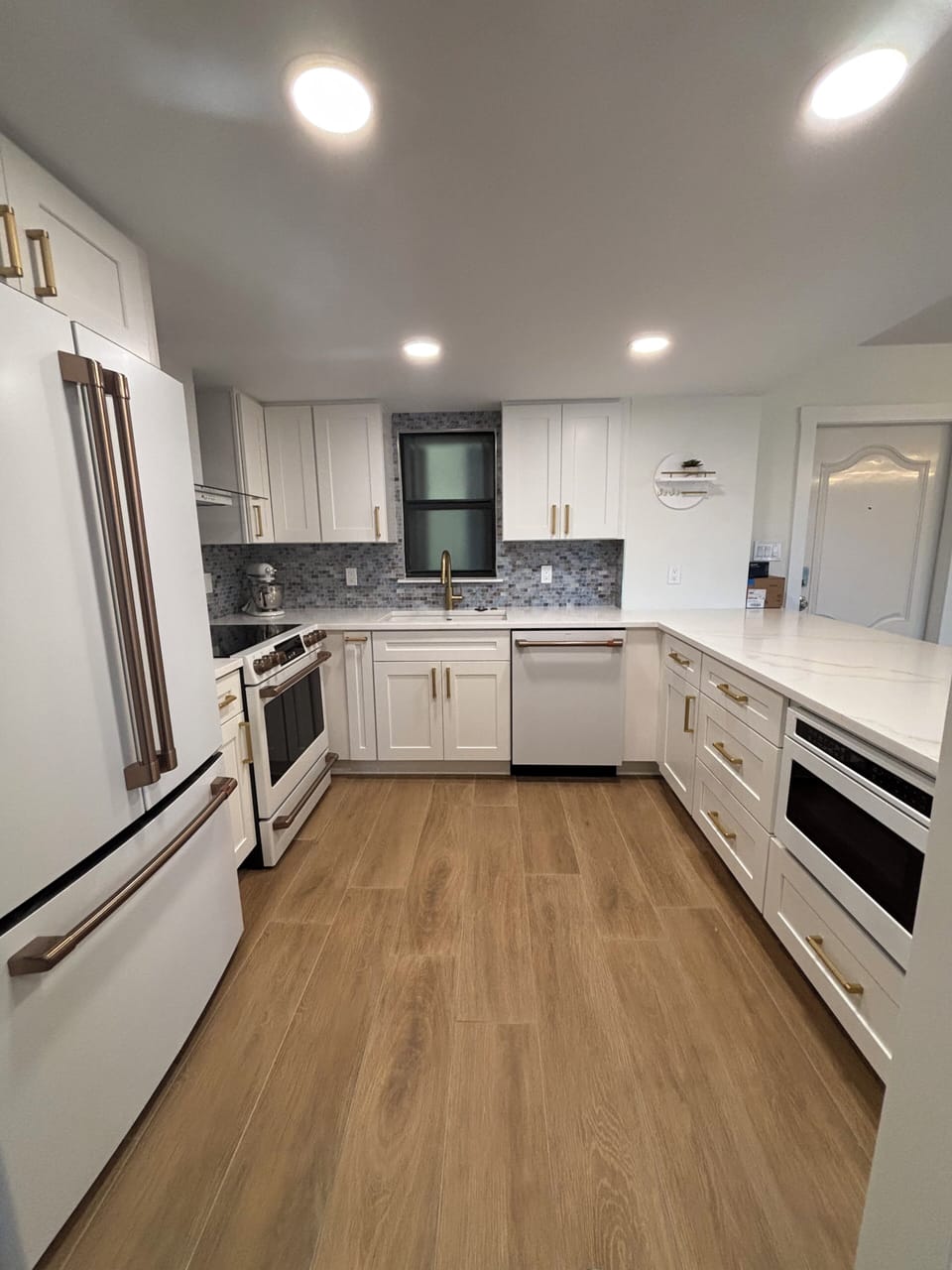 Custom kitchen featuring Cafe Appliances.