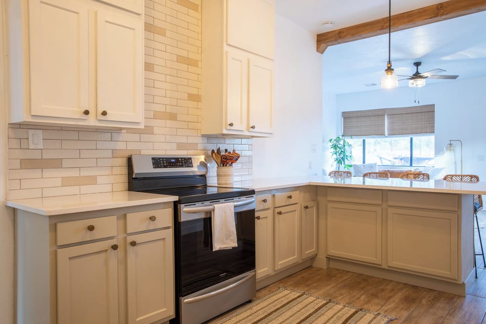 Fully stocked kitchen with bar seating- perfect for casual meals/morning coffee