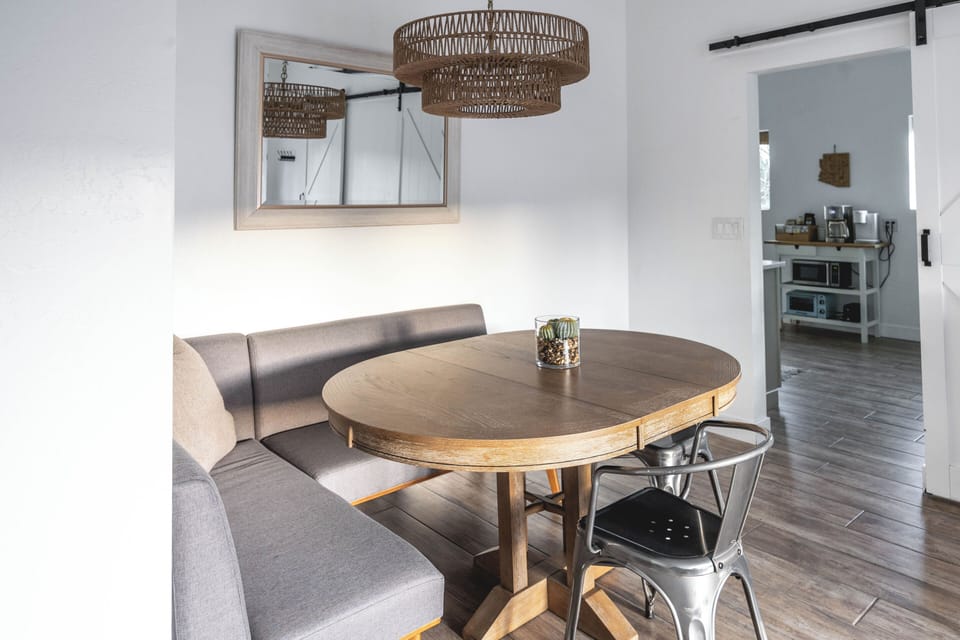 The dining area features a table that comfortably seats six 