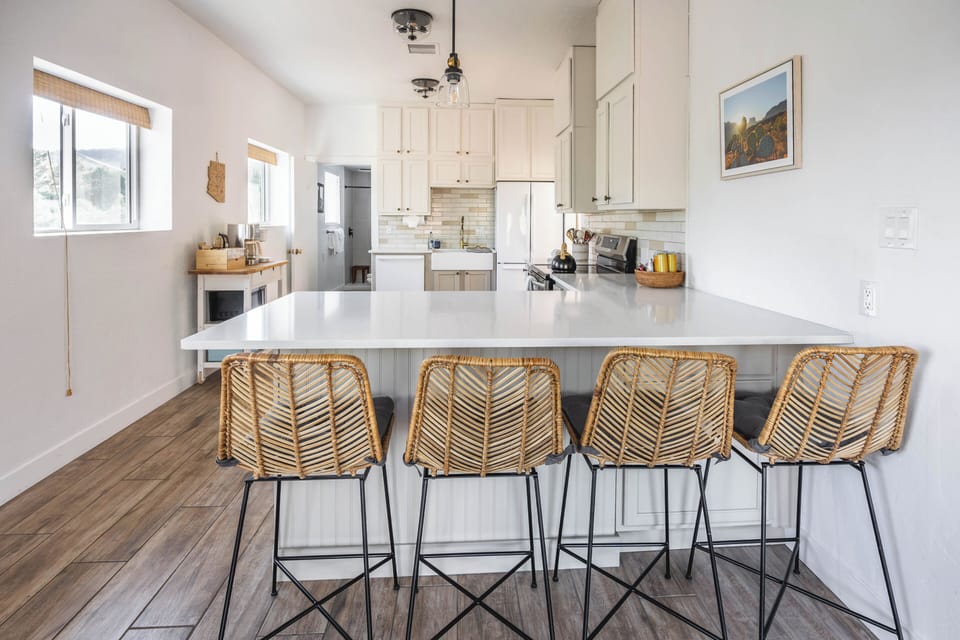 Bright, modern kitchen with bar seating & coffee/tea bar plus toaster & oven
