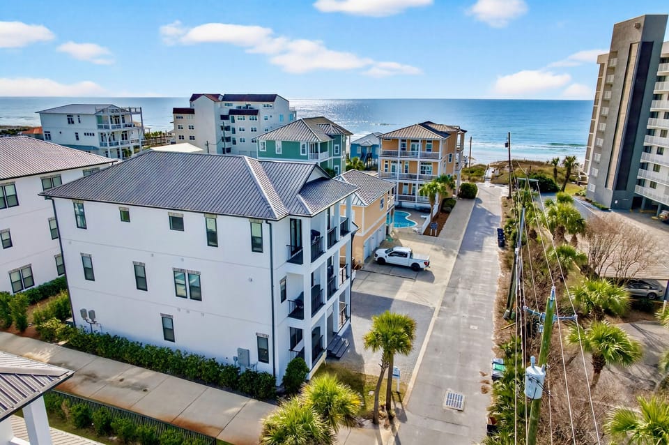 Arcadia Sands is the ultimate luxury beach retreat that SLEEPS 36! Just steps from PRIVATE beach access with OCEAN VIEWS. Enjoy a heated pool, hot tub, outdoor kitchen, game room, and private movie theater—ideal for large groups and family vacations.