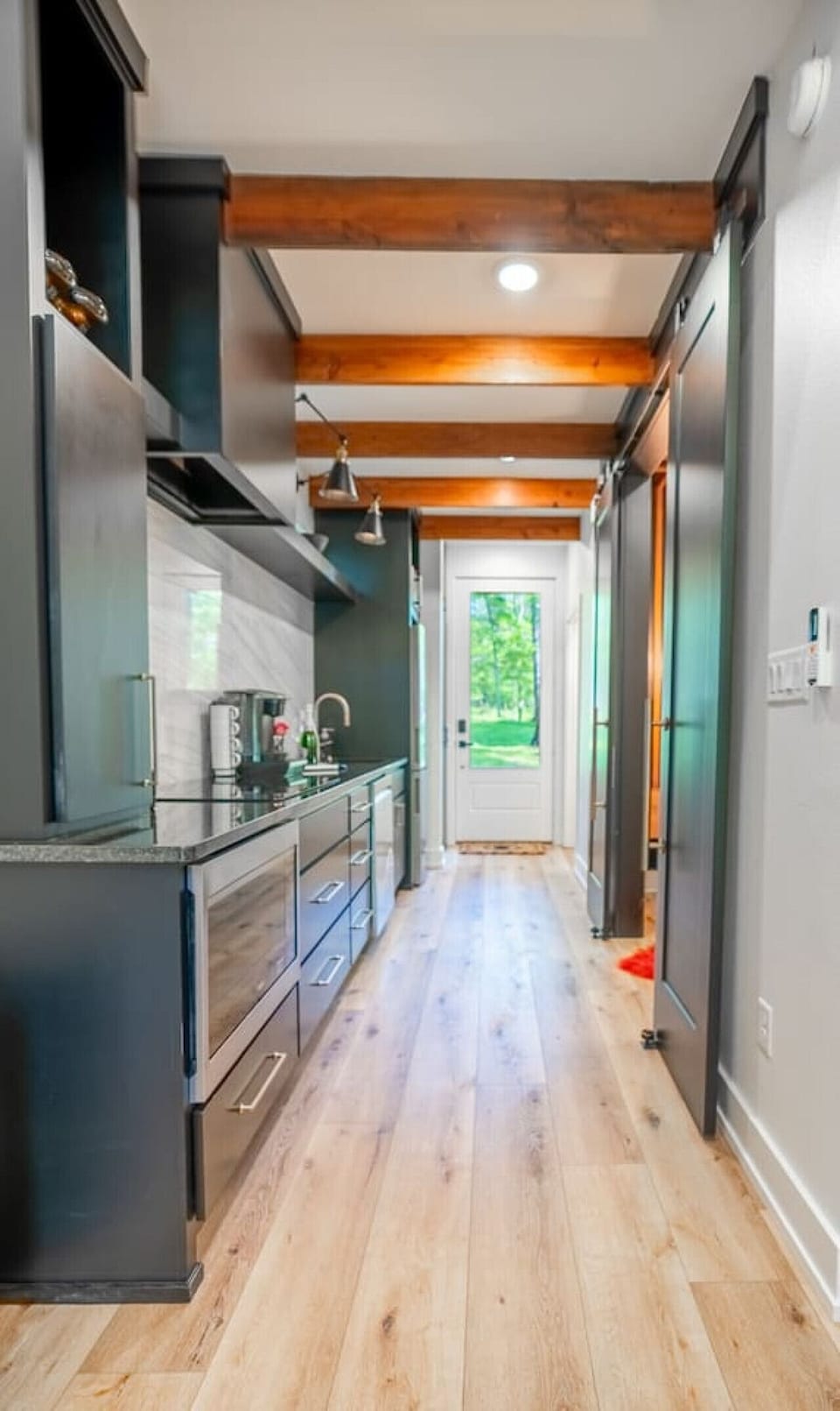 Open kitchen layout with natural light, modern finishes, and direct outdoor access.
