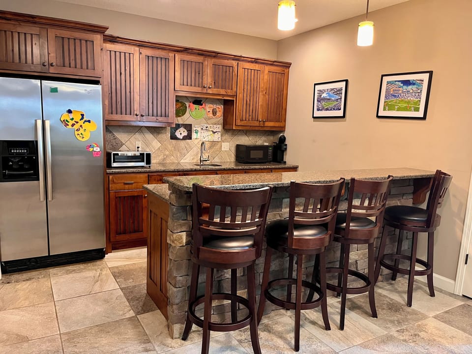 Downstairs bar area. Full refrigerator. Air fryer and microwave.