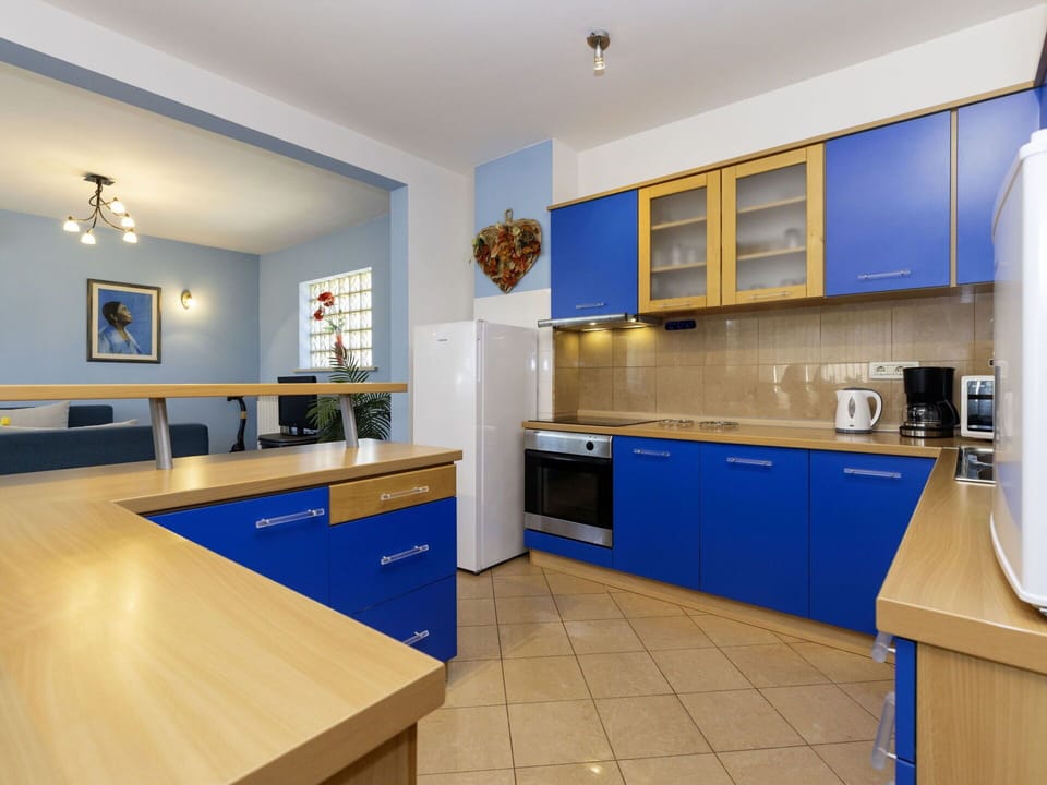 Blue, Furniture, Wood, Flooring, Interior Design, Kitchen, Cabinetry, Countertop, Floor, Lighting