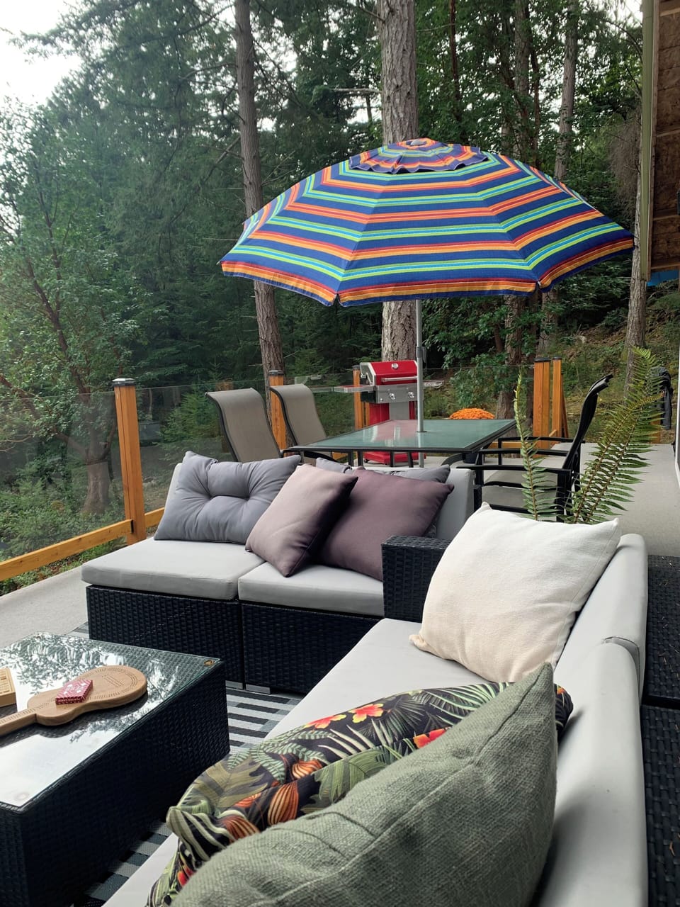 Large deck with ocean view. Dining table, lounge set & BBQ. Access from kitchen