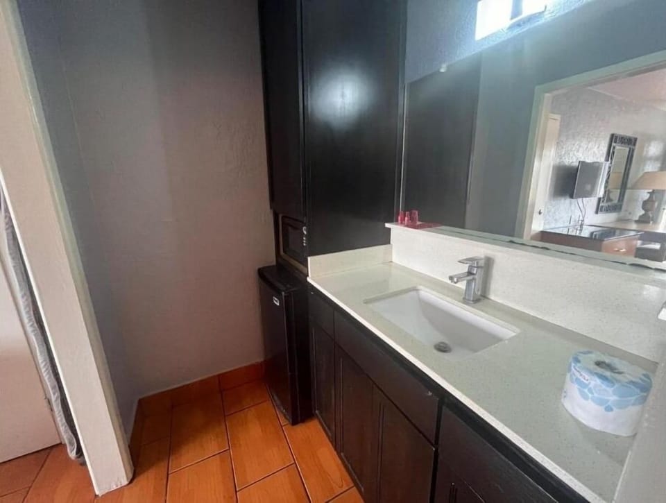 Freshen up easily with a bright vanity and ample mirror space.