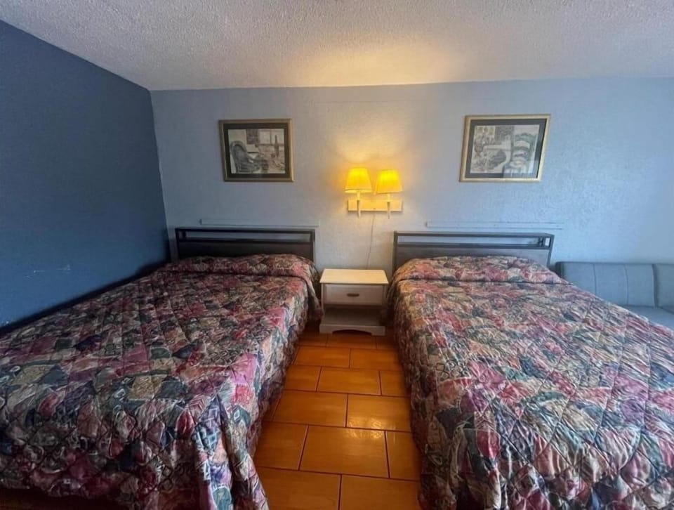 Sleep soundly with two beds and warm bedside lighting.