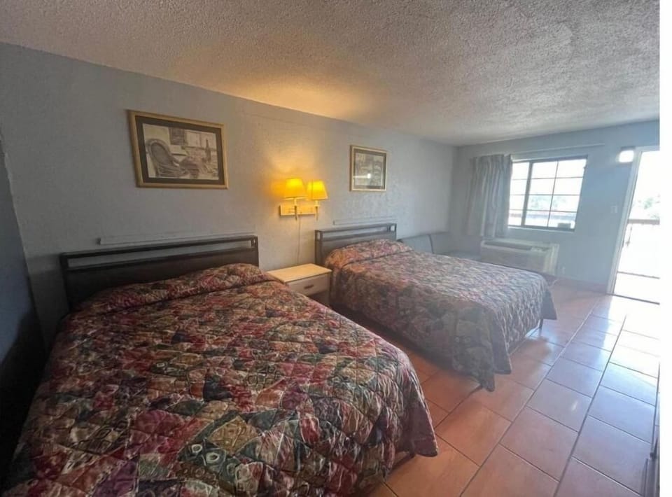Settle into two comfy beds beside bright window light.