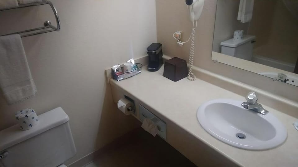 Get ready with a spacious vanity and bright mirror lighting.