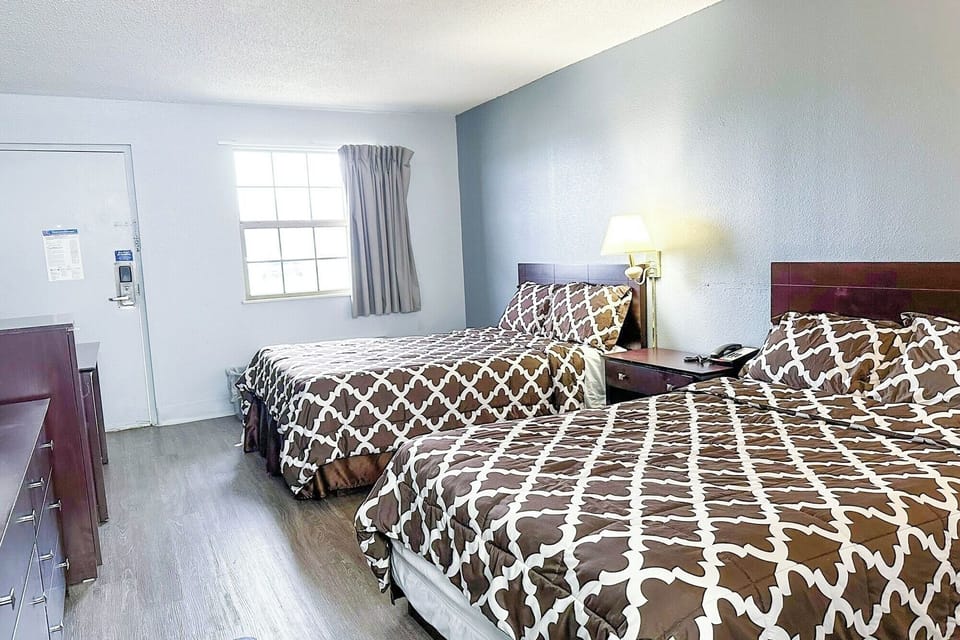 Drift off comfortably with twin beds and soft, warm lighting.