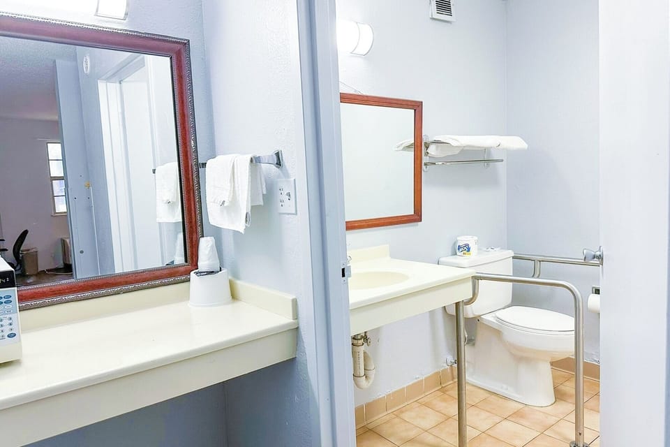 Refresh easily with an accessible bath setup and wide vanity.