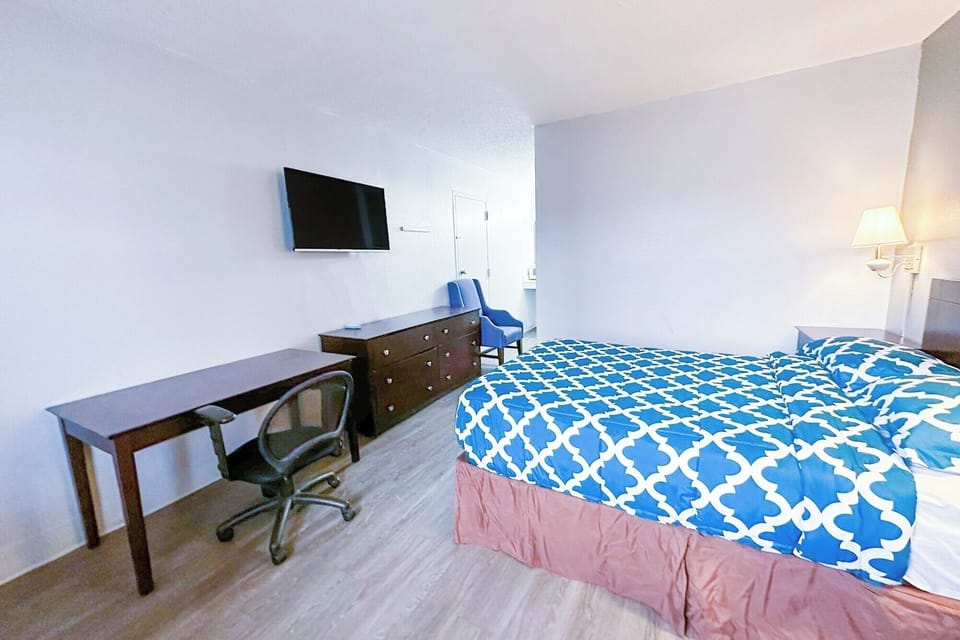 Settle in with a roomy layout, TV, and work desk.