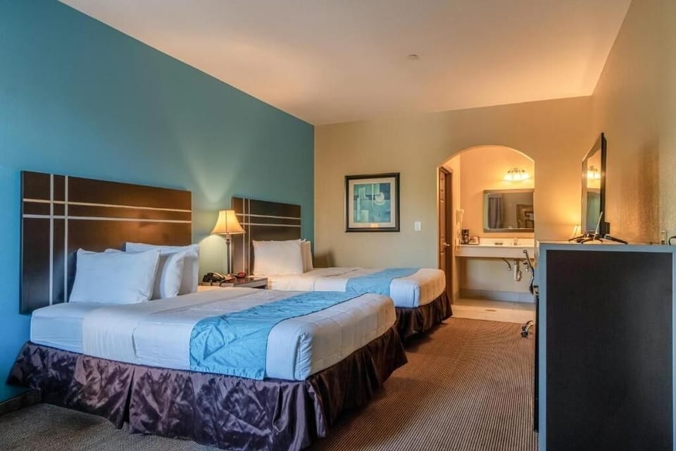 Relax with warm bedside lamps and plenty of open floor space.