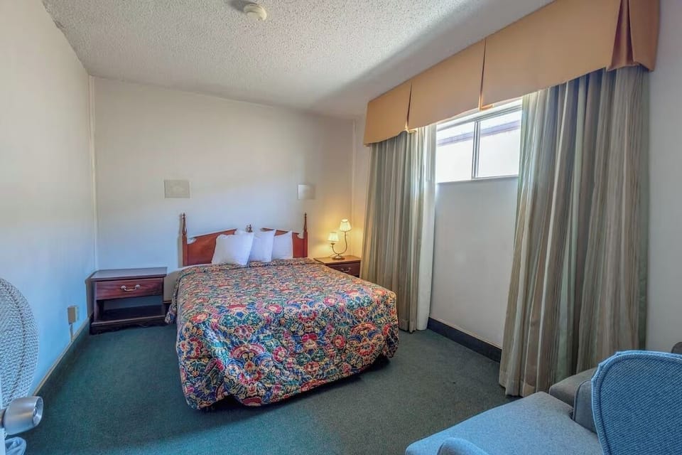 Wake gently in a bright room with classic, comfy bed.