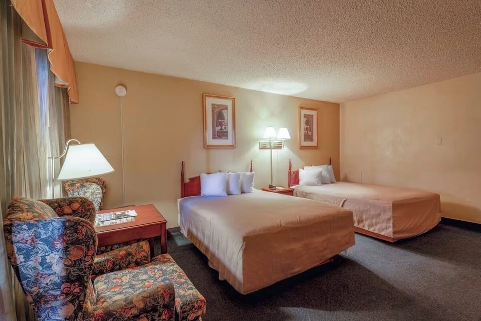 Enjoy a calming twin-bed layout with warm bedside lamps.