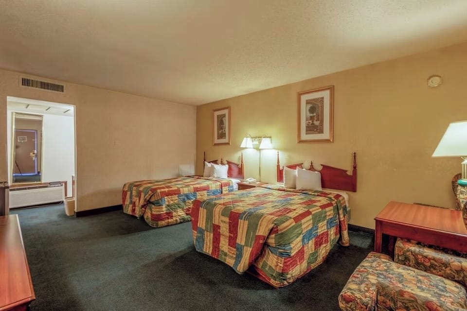 Relax with bedside lighting and a simple, spacious setup.