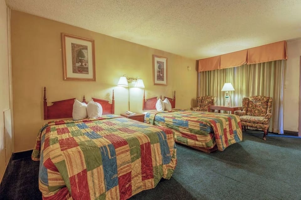 Settle into two comfy beds with lamps for late-night reading.