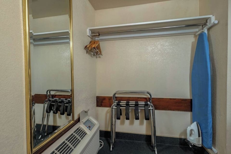 Stay organized with handy closet space and ironing essentials provided.