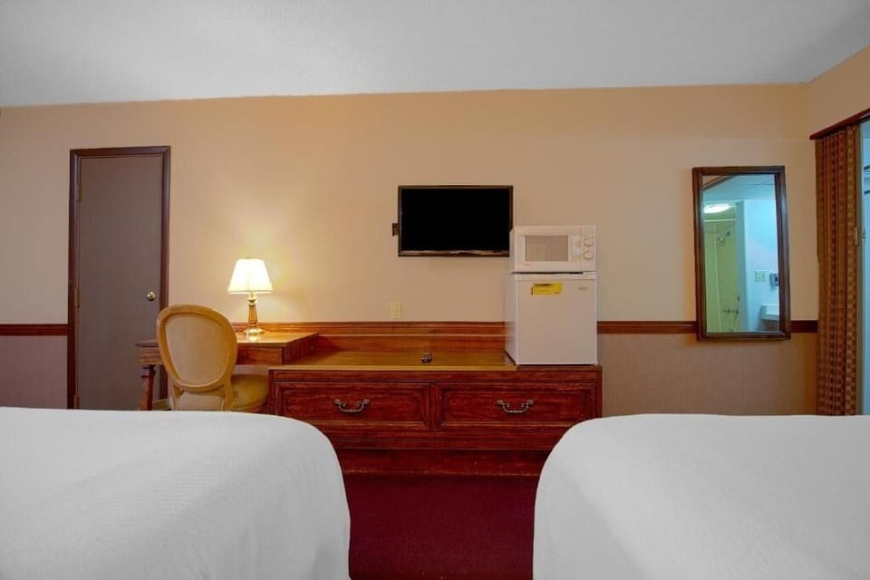 Recharge after adventures in a comfortable double-bed room setup.
