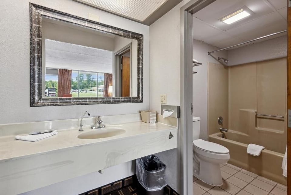 Refresh comfortably with a bright vanity and private bath.
