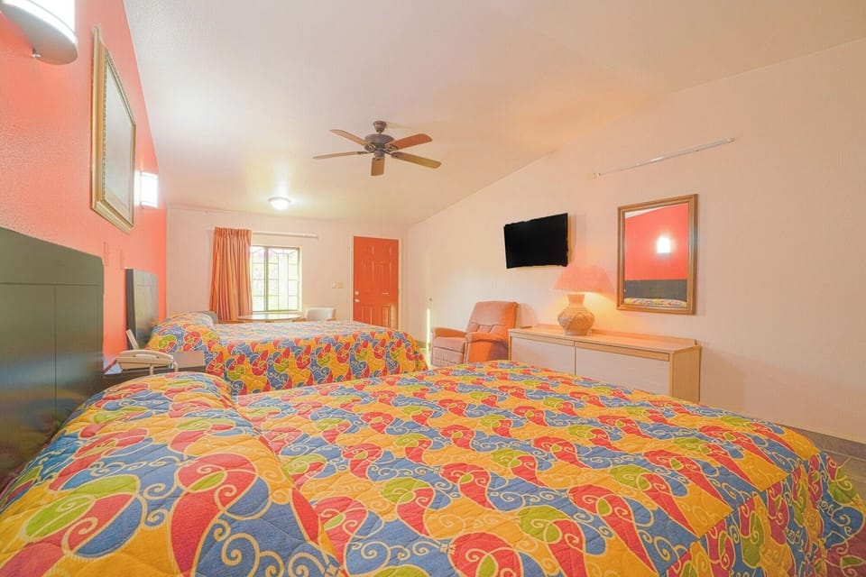 Drift into comfort with two plush beds and airy space.
