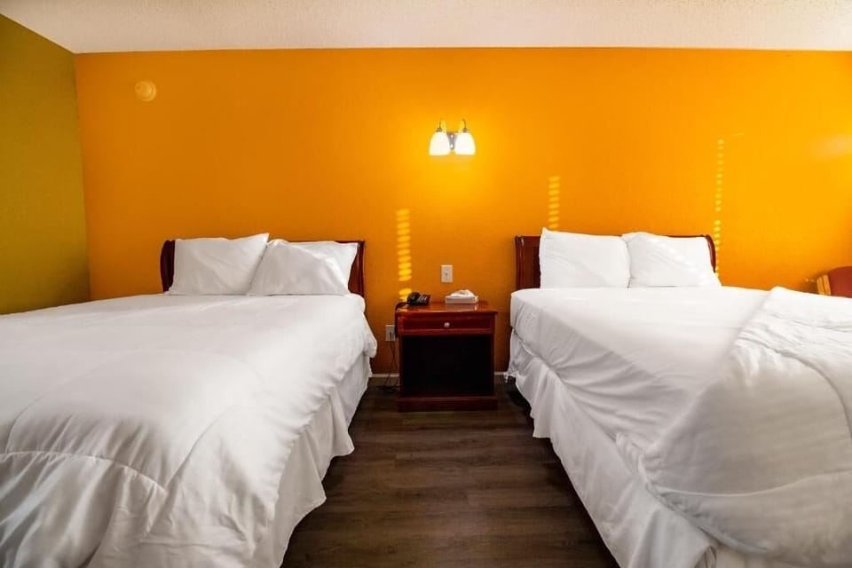 Share the space comfortably with two inviting beds and soft lighting.