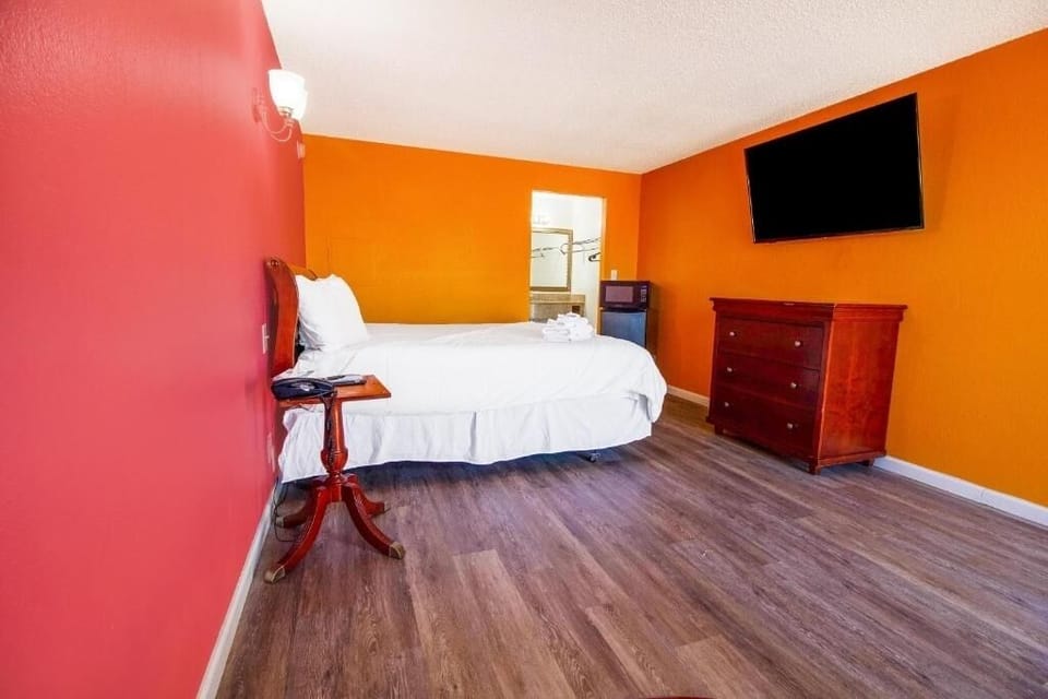 Kick back with a wide-open room and wall-mounted TV.
