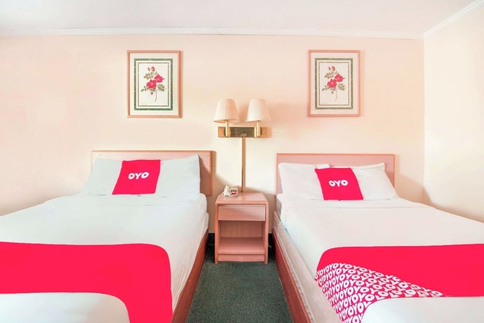 Drift off happily in crisp linens under warm bedside lighting.