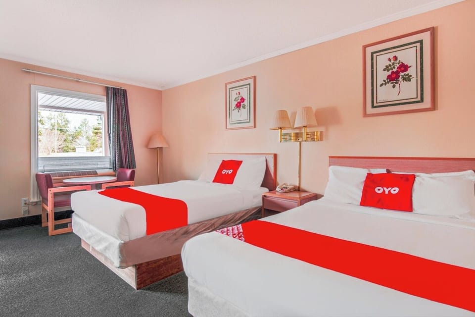 Settle into bright comfort with two beds and window nook.
