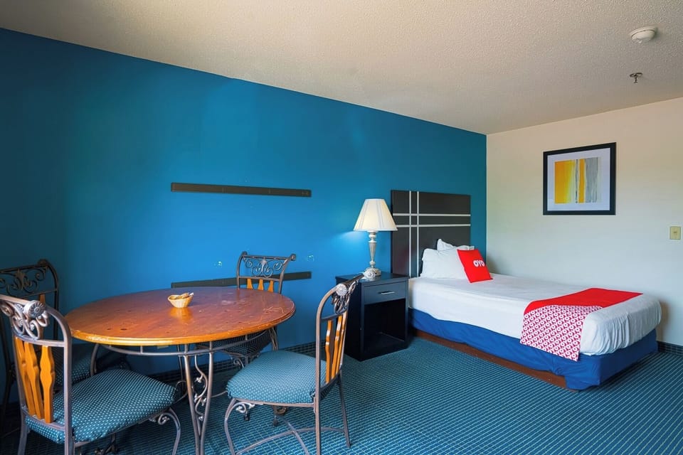 Gather for late-night snacks at the table beside your bed.