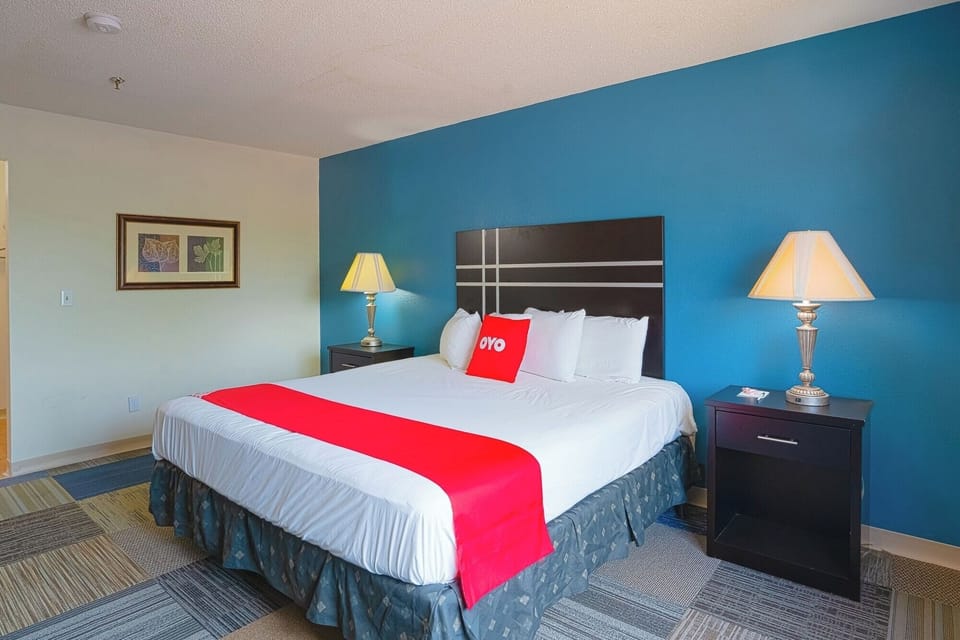 Drift off comfortably with bedside lamps and a cozy headboard.
