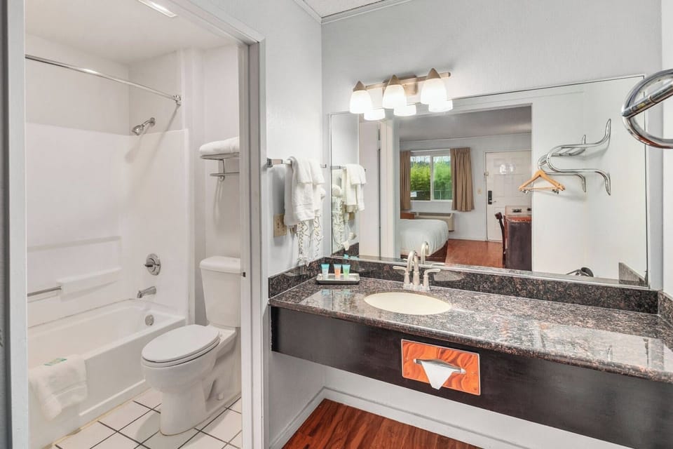 Get ready with a spacious vanity and well-lit mirror
