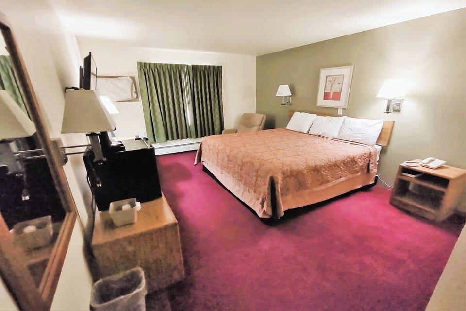 Wake up to soft daylight and a comfortable, inviting bed.
