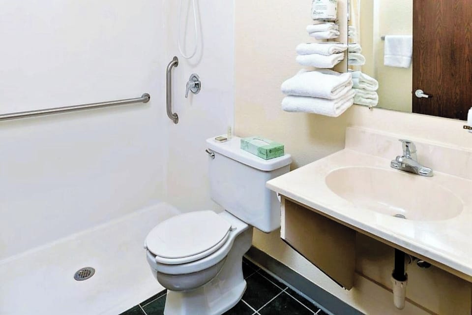 Recharge in comfort with in-room cooling and workspace.