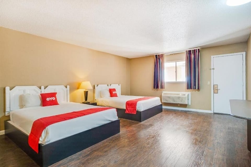 Relax together in a roomy double-bed layout with warm lighting.