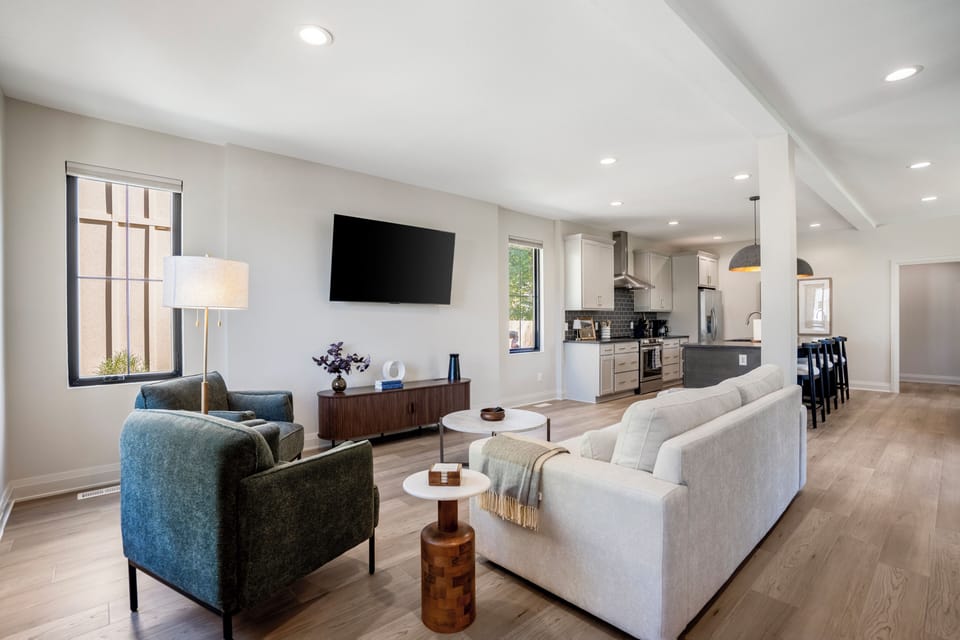 Comfortable living room area with a cozy couch and chairs—perfect for relaxing.