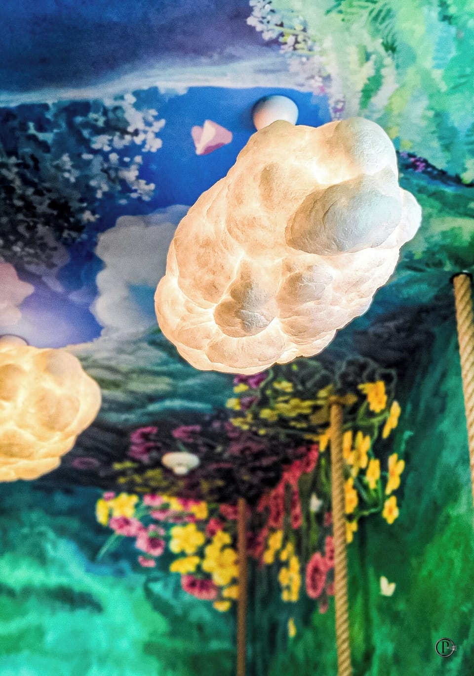 Totoro jungle room with rope beds, cloud lights & forest mural magic.