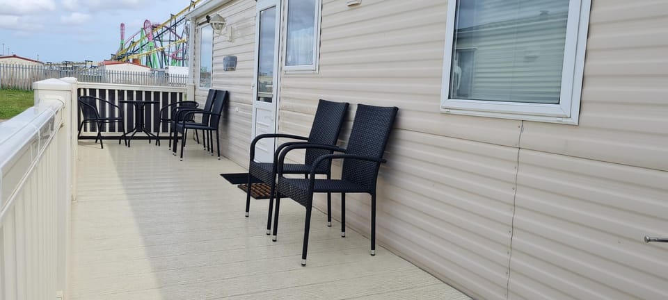 The decking area offers the perfect spot to start your day with a morning coffee or unwind in the evening air.