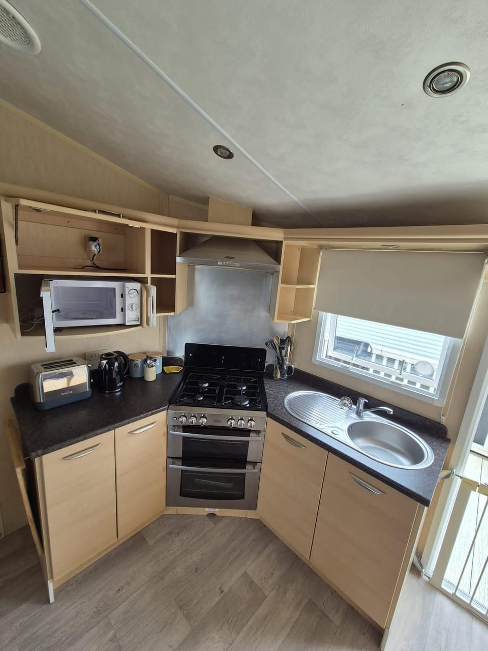 Prepare your favourite holiday meals while being part of the conversation in this convenient open plan caravan kitchen.