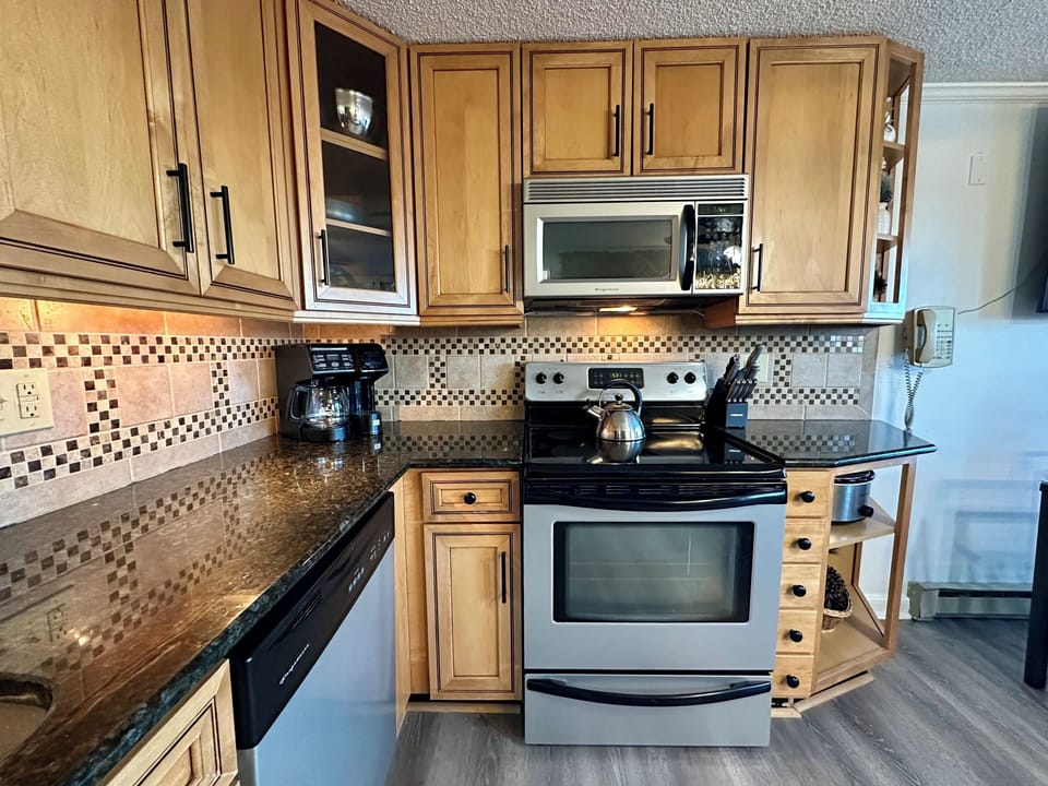 Granite tops & cabinet lights in case you sneak out of your room for a snack!