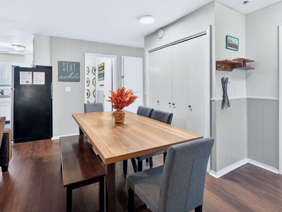 Bright dining nook with 6-seat table, near kitchen—gather and dine.
