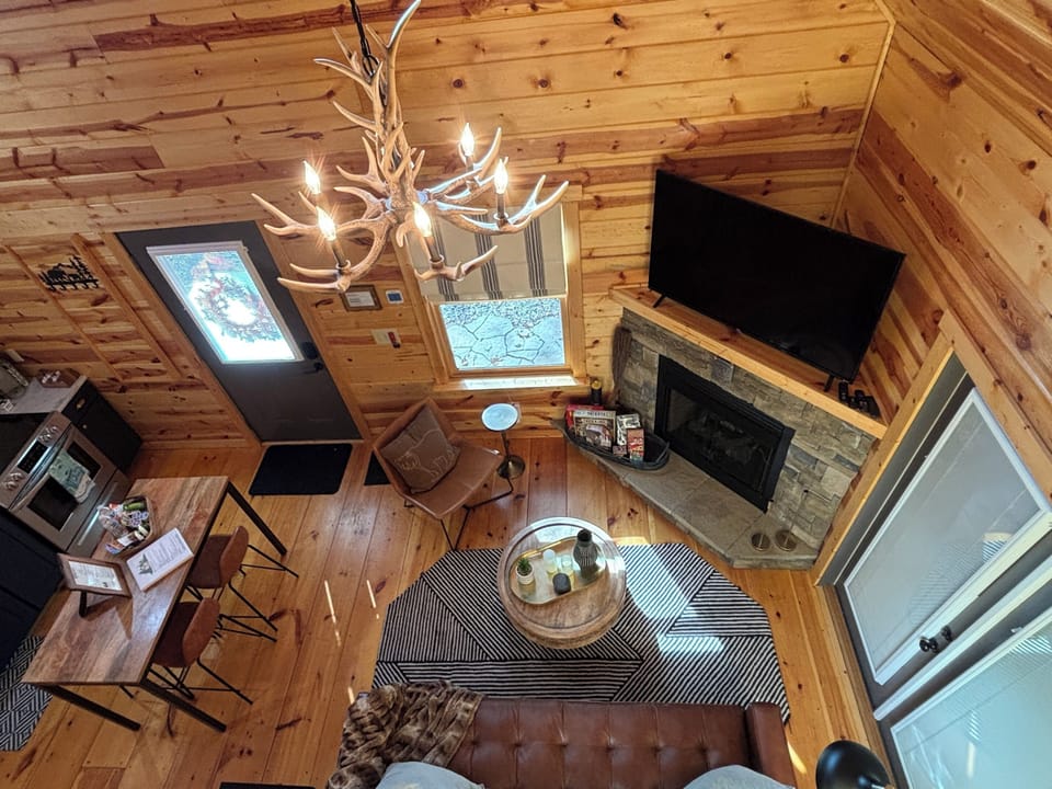 Cozy living room ~ relax by the fire, watch TV, or step outside to the patio.