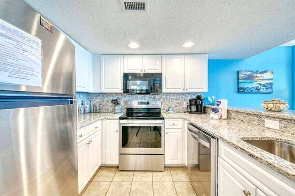 Stocked Kitchen with Beautiful Granite Countertops